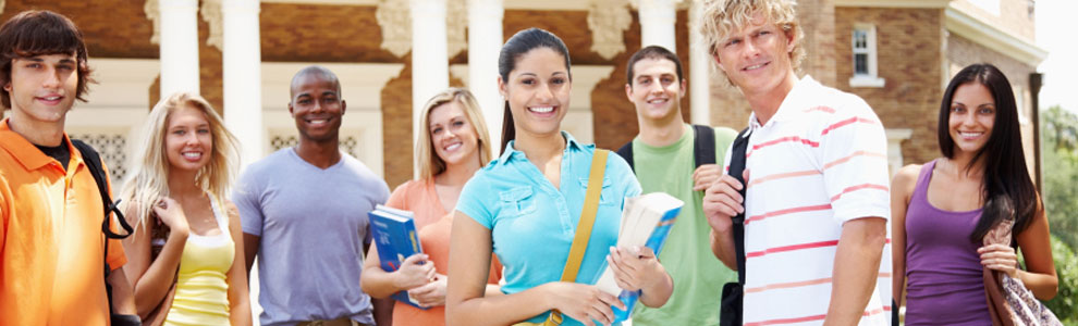 Group of young students holding books and bags on campus
